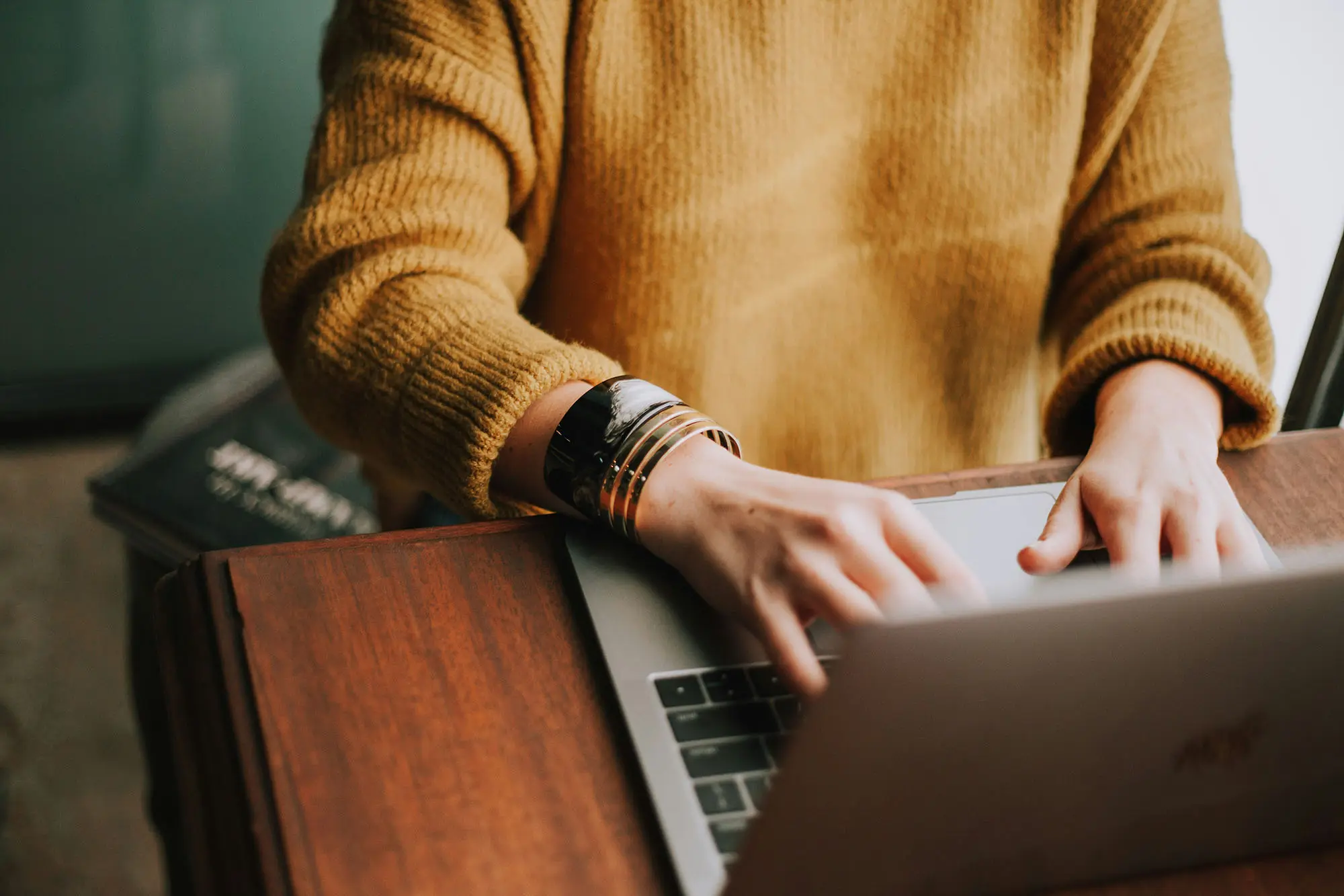 woman working on laptop at her desk